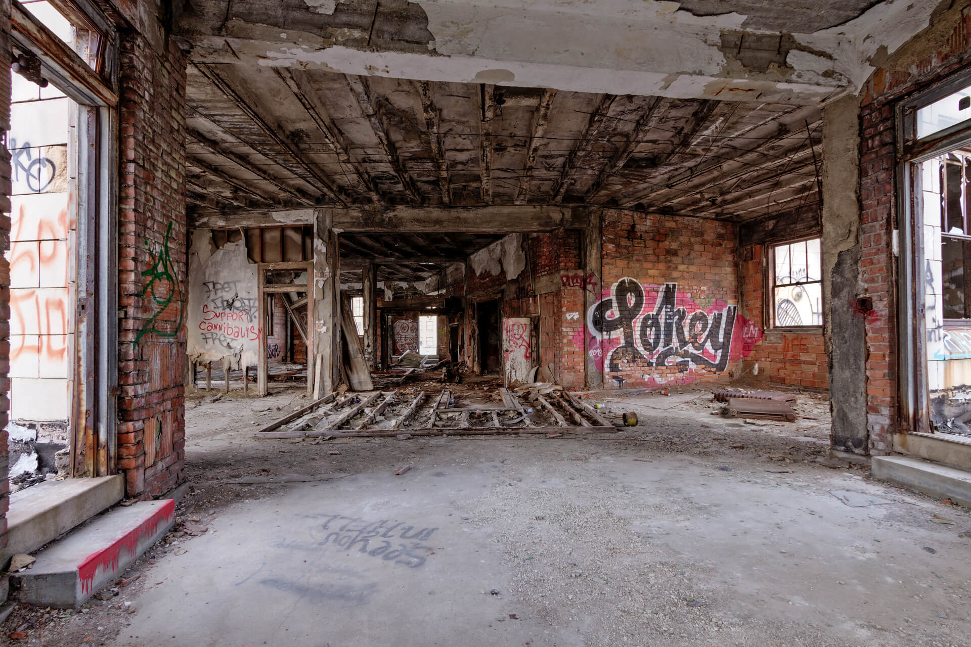 The Monarch Club before reconstruction has walls of rust and graffiti.