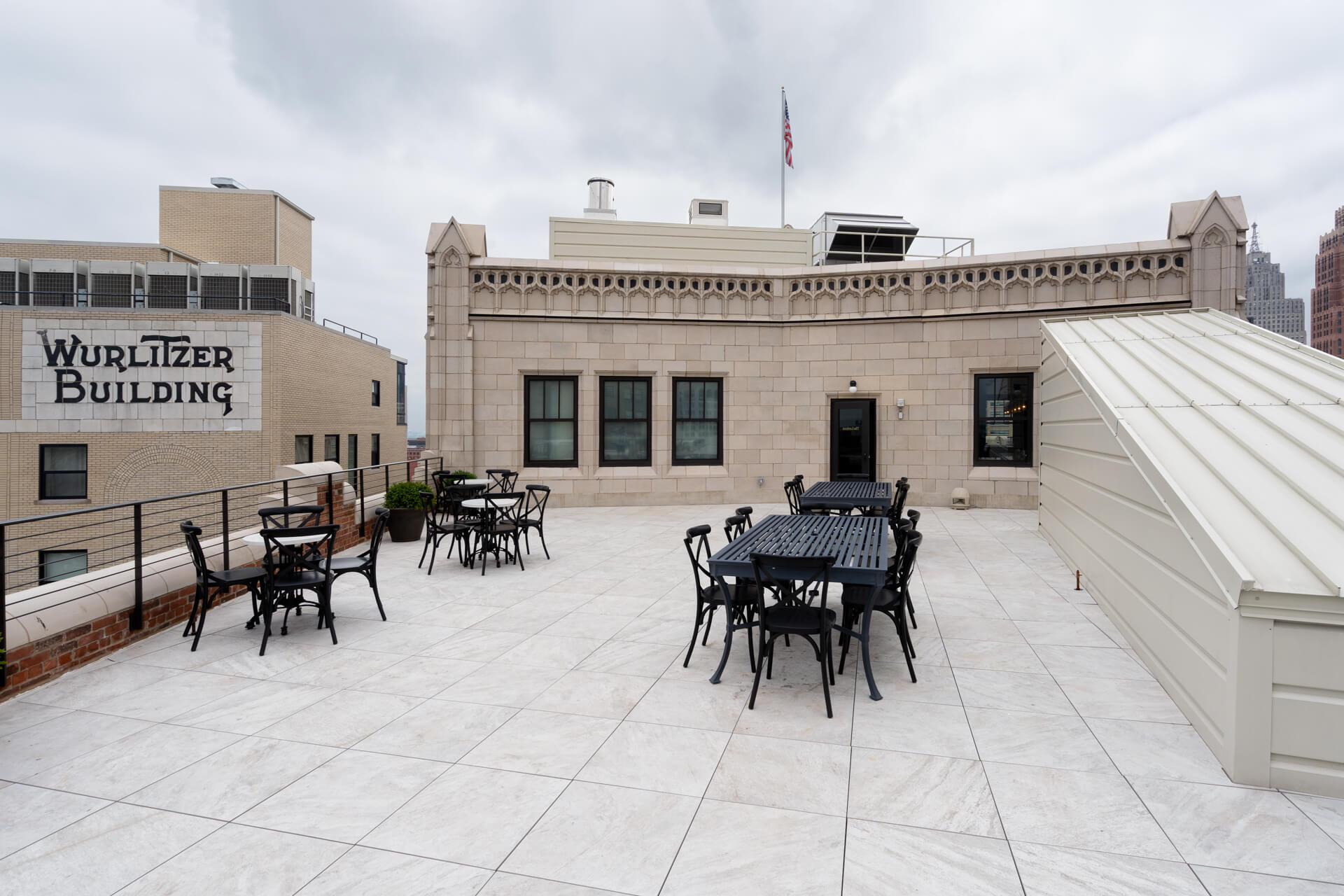 The Monarch Club patio after construction has repaired parapet walls, stonework and seating.