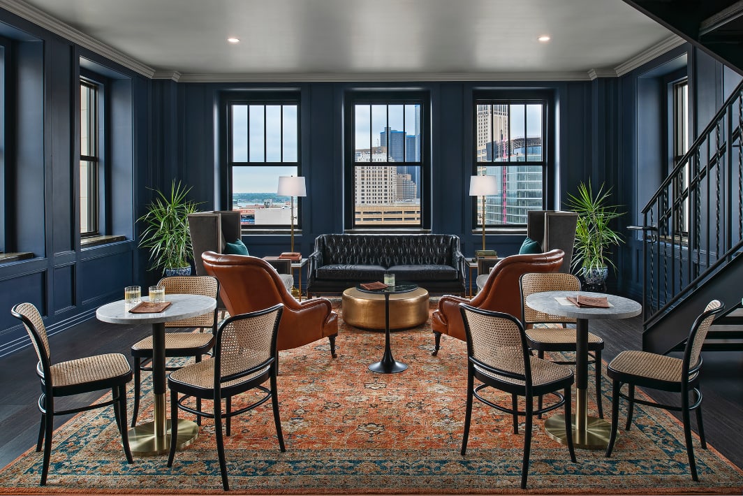 The Tower room at The Monarch Club bars in downtown Detroit has leather couches and skyline windows.